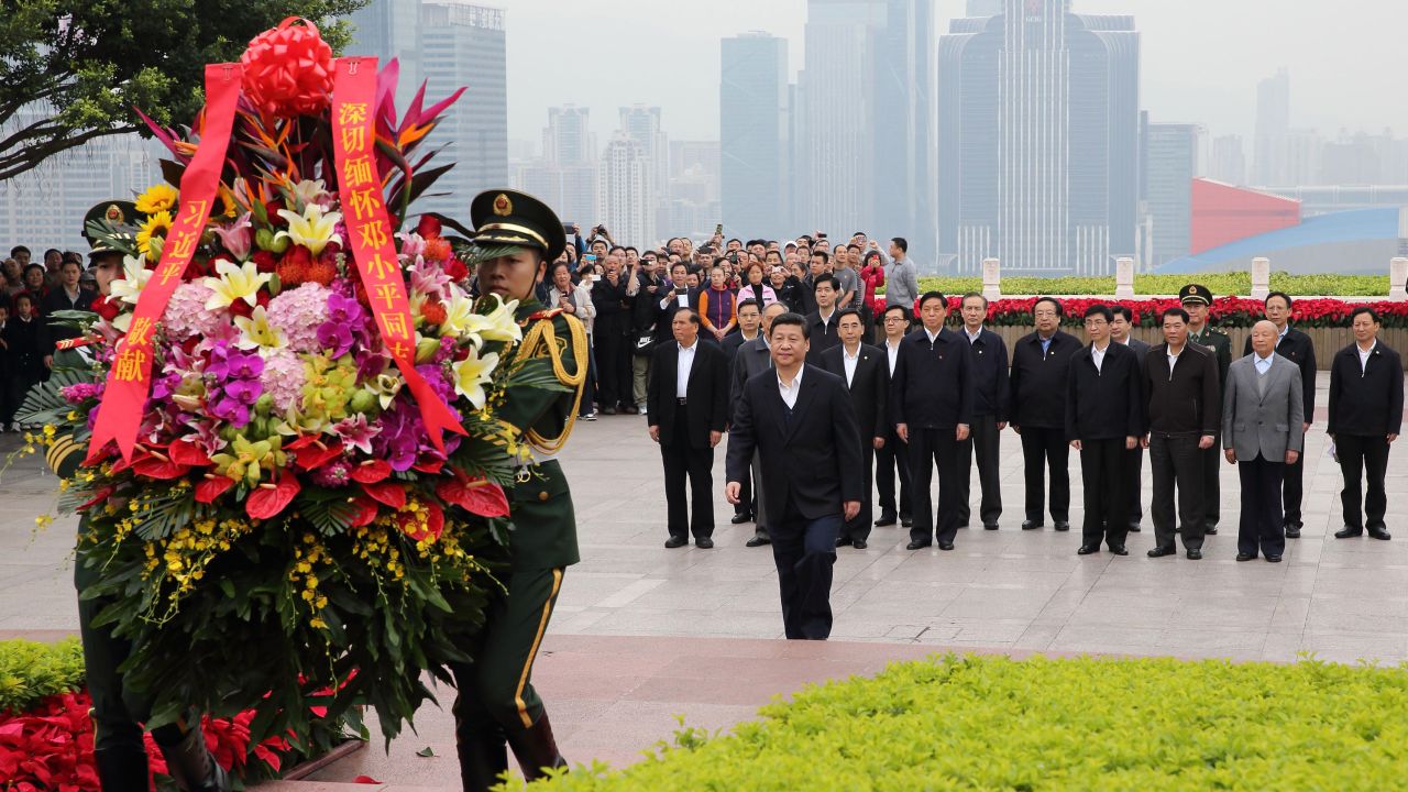 Xi Jinping, general secretary of the Communist Party of China (CPC) Central Committee and chairman of the CPC Central Military Commission (CMC), lays a wreath to the statue of late Chinese leader Deng Xiaoping in Shenzhen on December 11, 2012.