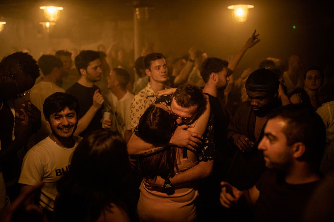 Two people hug at the Egg nightclub in London early Monday. 