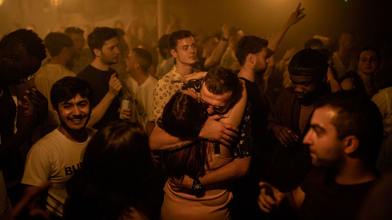Two people hug at the Egg nightclub in London early Monday. 