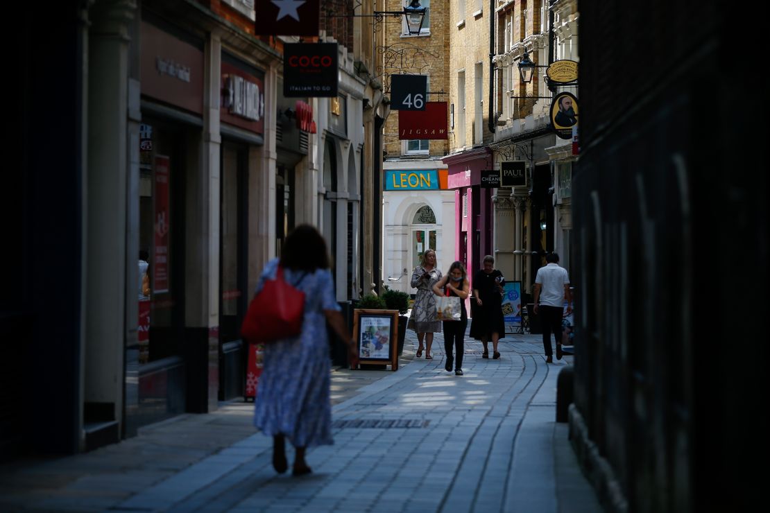 Pedestrians on Bow Street on so-called 'Freedom Day' in the City of London on Monday, July 19, 2021.