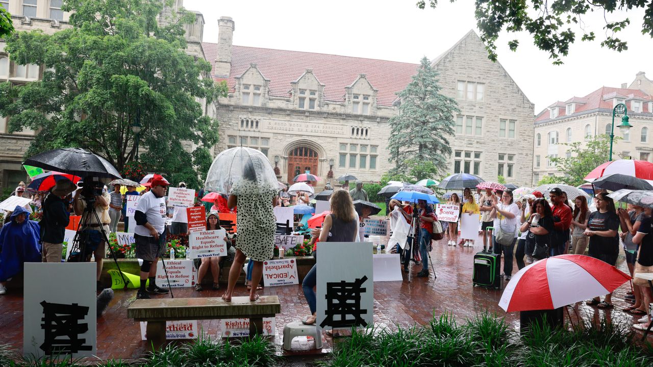 Anti-vaxxers and anti-maskers gathered at Indiana University's Sample Gates June 10 to protest the school's Covid-19 vaccination requirements for the upcoming fall semester.