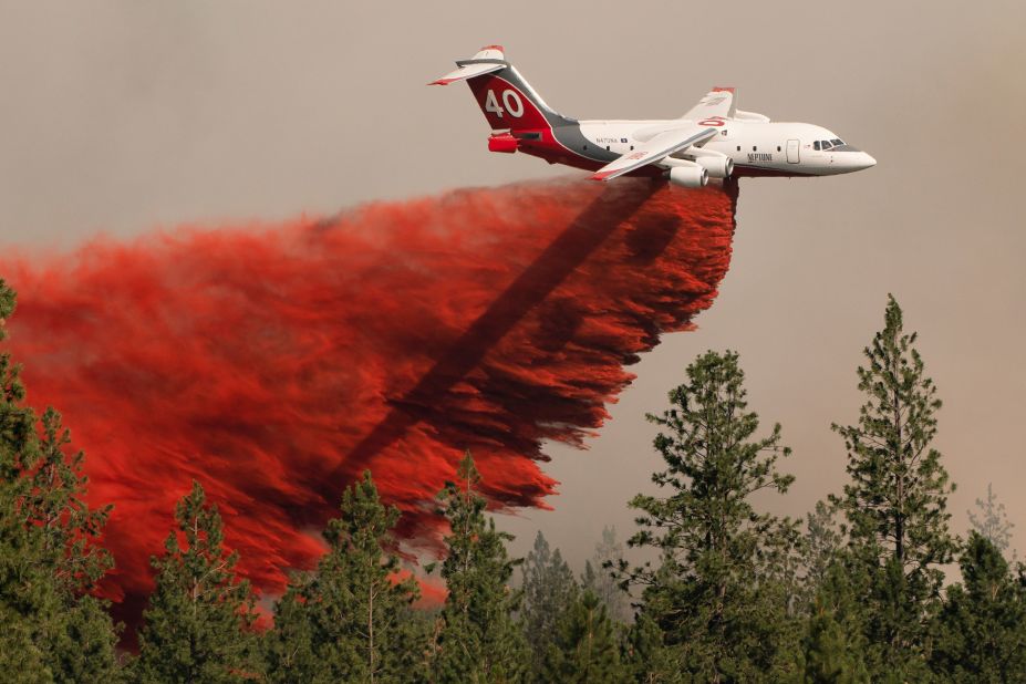 An airplane drops fire retardant on the Chuweah Creek Fire in Washington on July 14.