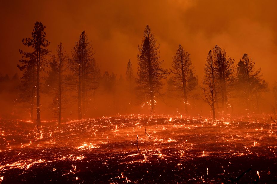 Embers blow across a field as the Sugar Fire burns in Doyle, California, on July 9.