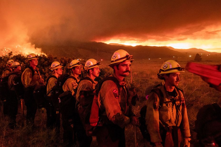 Firefighters monitor the Sugar Fire in Doyle, California, on July 9.