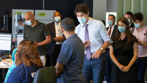 Canada's Prime Minister Justin Trudeau greets people as he visits a vaccination site in Montreal, Quebec, Canada on July 15, 2021. 