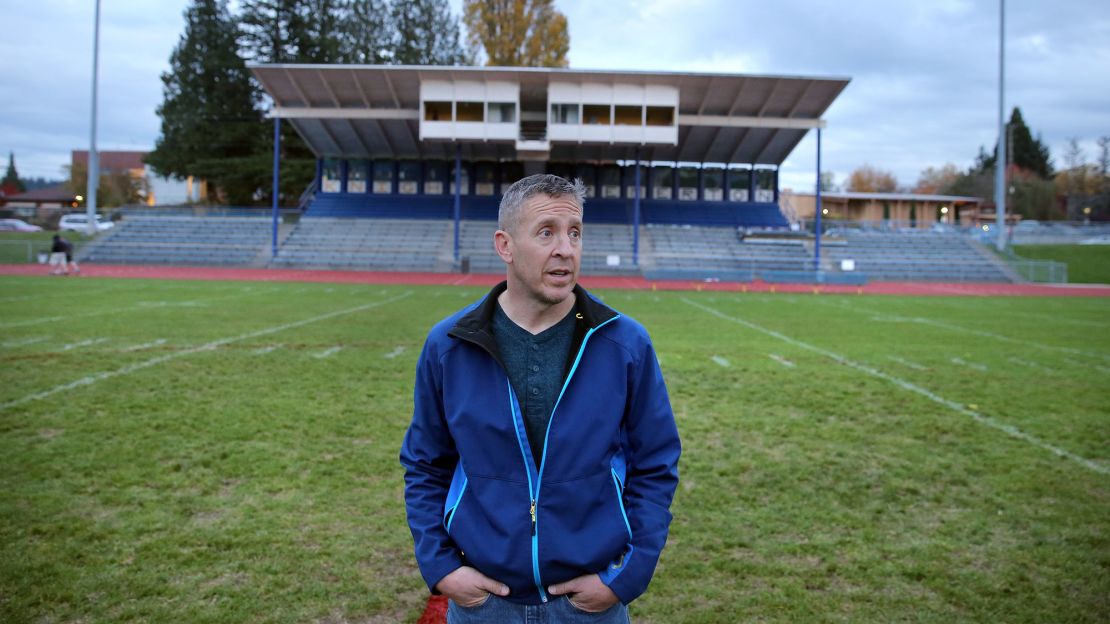Former Bremerton High School assistant football coach Joe Kennedy stands at the center of the field on the 50 yard line at Bremerton Memorial Stadium, Nov. 5, 2015.