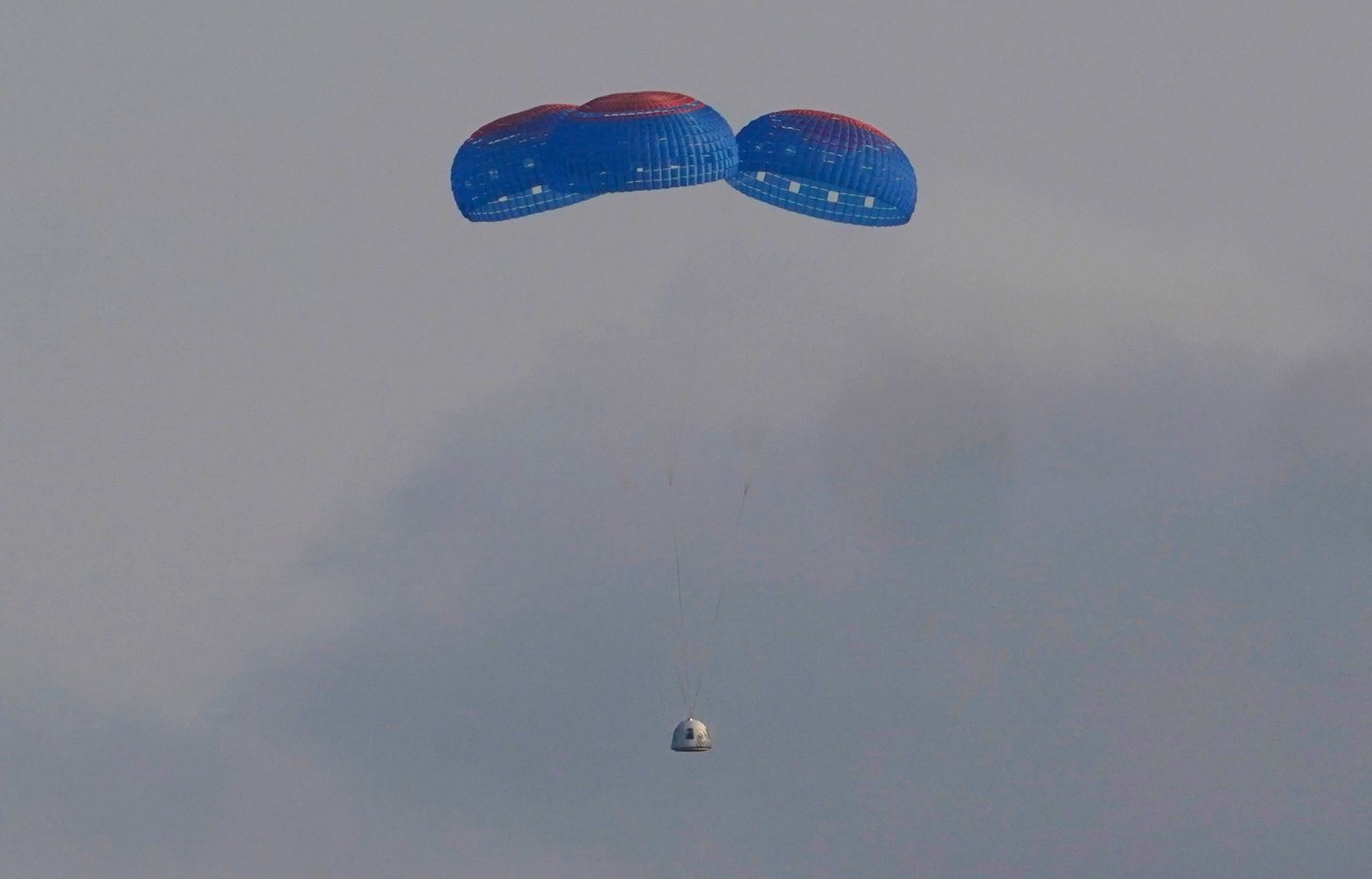 The New Shepard capsule parachutes safely back to Earth.