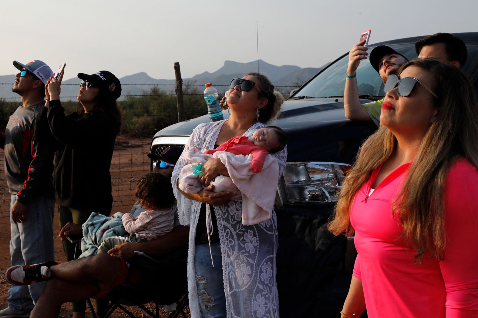 Spectators watch the launch near Van Horn.