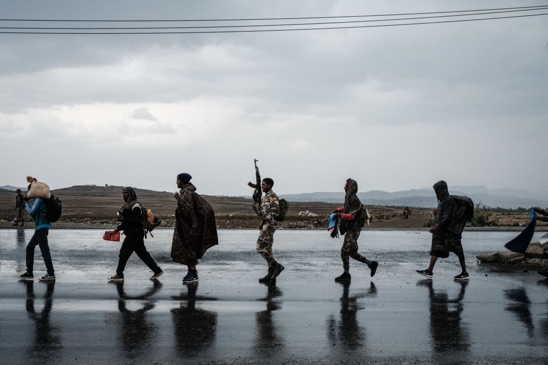 Soldiers from the Tigray Defense Force (TDF) walk in lines towards another field in Mekele, the capital of Ethiopia's Tigray region, on June 30.