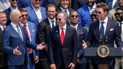 WASHINGTON, DC - JULY 20: (L-R) U.S. President Joe Biden laughs as quarterback Tom Brady jokes while speaking as the 2021 NFL Super Bowl champion Tampa Bay Buccaneers are welcomed to the South Lawn of the White House on July 20, 2021 in Washington, DC. (Photo by Drew Angerer/Getty Images)