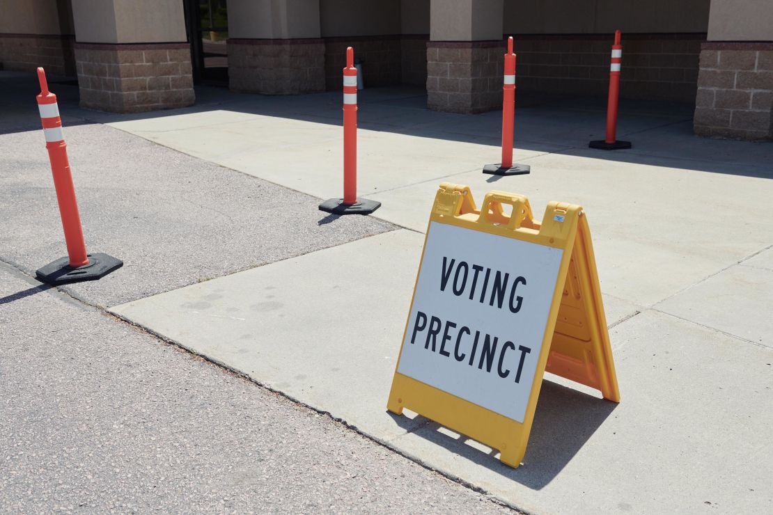 A "Voting Precinct" sign stands on display outside a polling location in Sioux Falls, South Dakota, June 2020. 