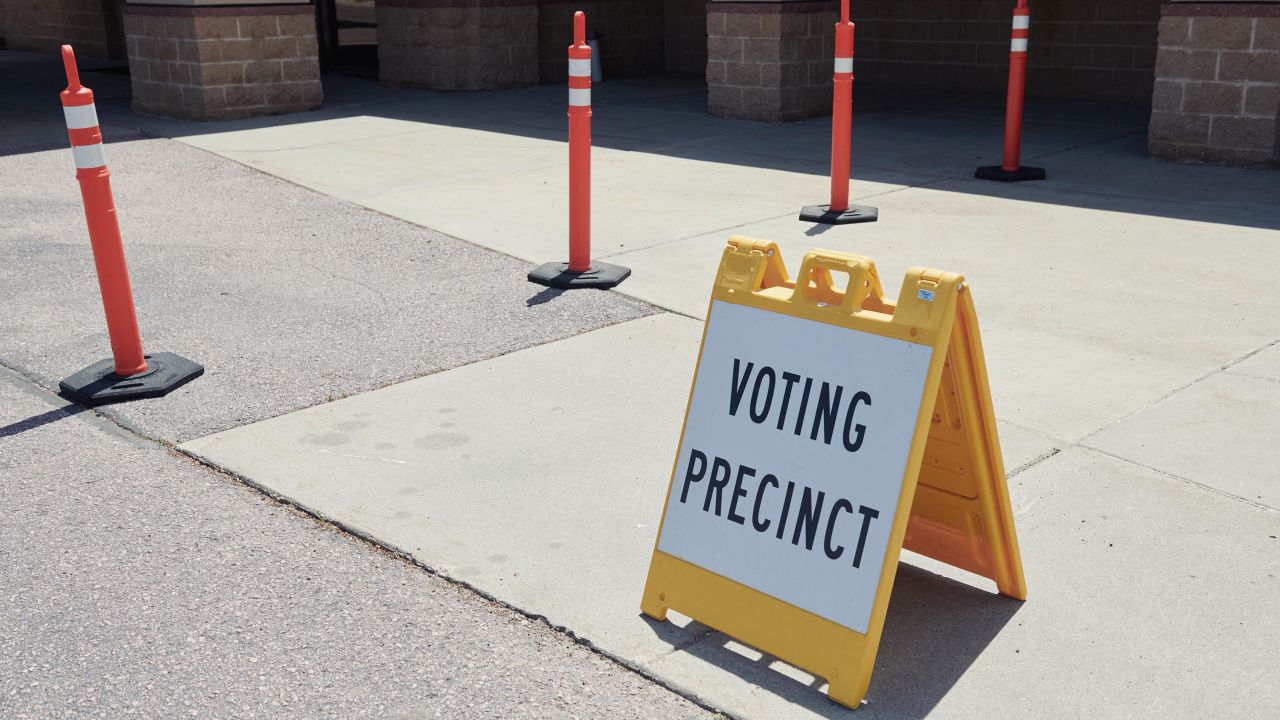 A "Voting Precinct" sign stands on display outside a polling location in Sioux Falls, South Dakota, June 2020.