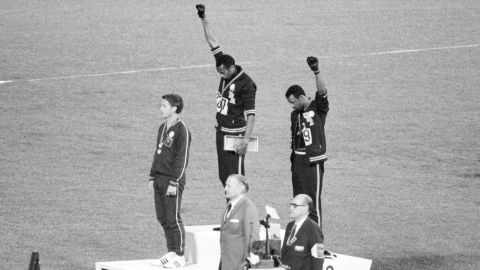 In one of the most well-known Olympic protests, US gold and bronze medalists Tommie Smith (center) and John Carlos (right) raised their fists as a "Black Power" gesture during a 1968 medal ceremony in Mexico City.  