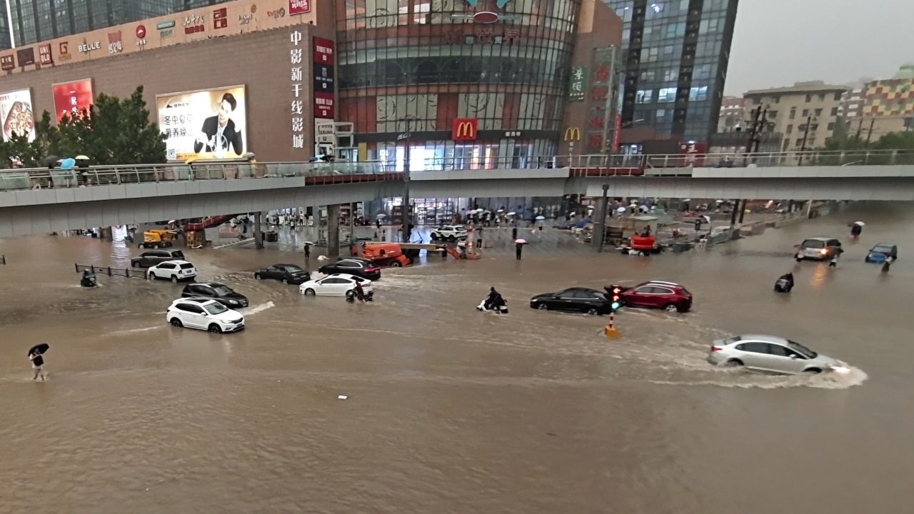 Vehicles are stranded after a heavy downpour in Zhengzhou city, central China's Henan province on Tuesday. 