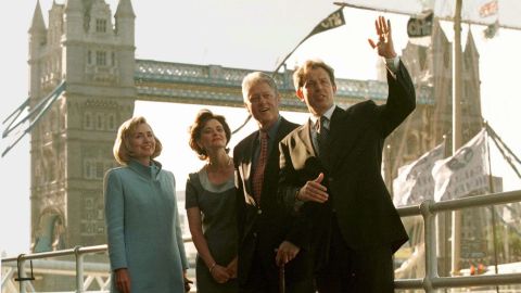 US President Bill Clinton and his wife Hillary pose in front of London's Tower Bridge with British Prime Minister Tony Blair his wife Cherie, center left, on May 29, 1997 before dining in a nearby restaurant. 