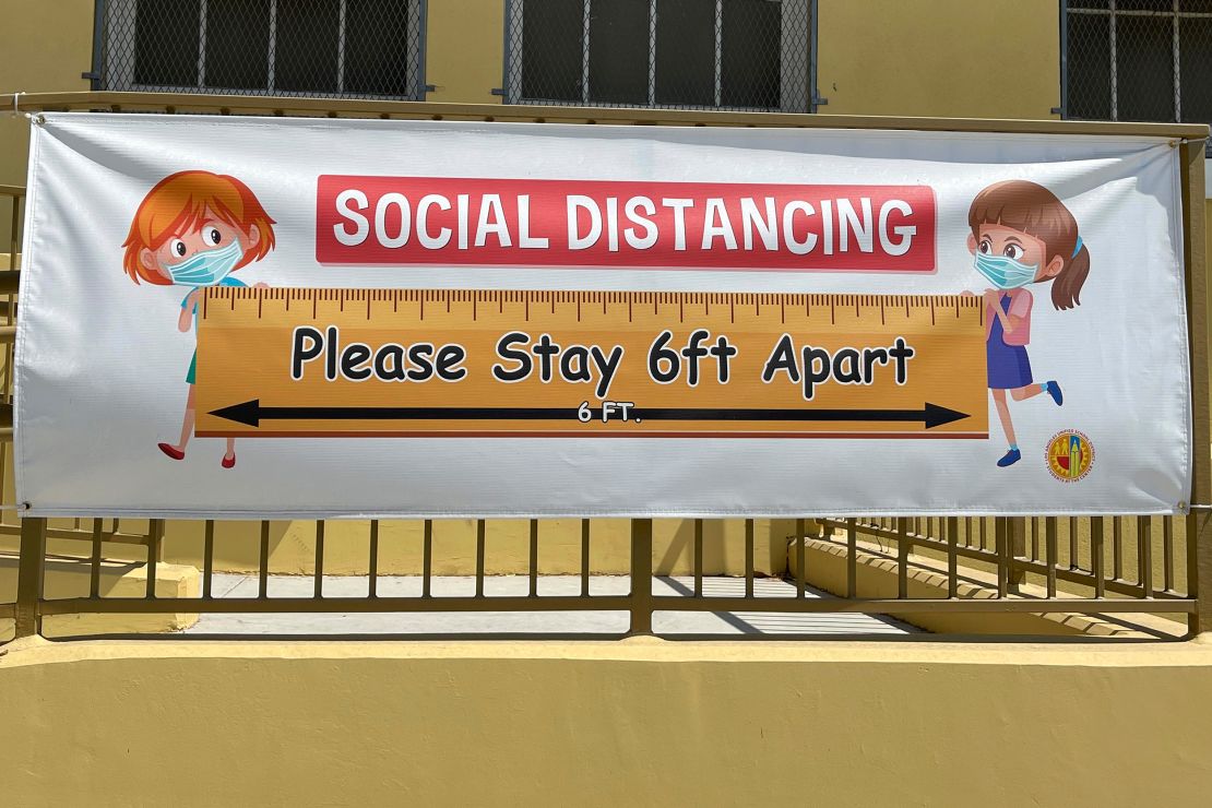 A social distancing sign hangs at Morris K. Hamasaki Elementary School in Los Angeles on July 1.