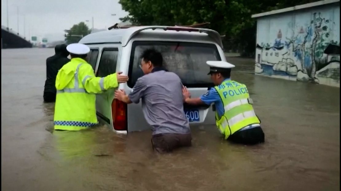 The heavy flooding submerged roads and swept cars away.