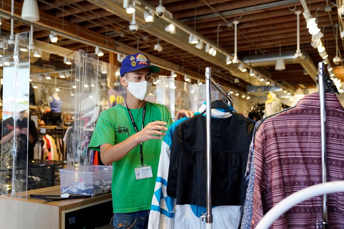 An employee sorts a rack at 2nd Street second hand store in the Fairfax district of Los Angeles.
