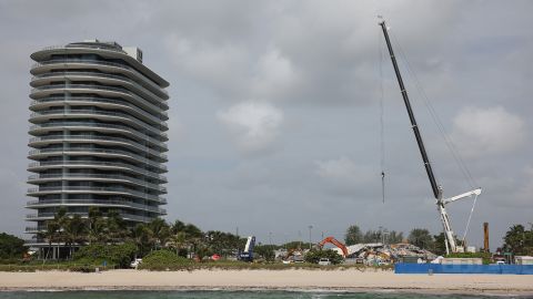 Cranes operate over the remains of the collapsed 12-story Champlain Towers South condo on July 09, 2021.