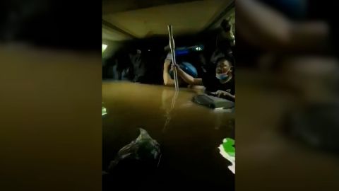 Passengers stranded in a flooded subway car in Zhengzhou, China, on July 20.