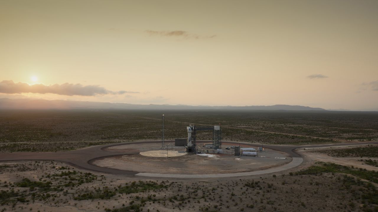 The New Shepard rocket sits on the launchpad.