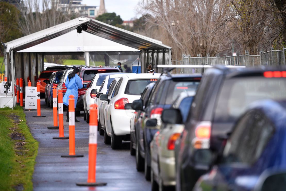 Cars wait in line at a drive-through Covid-19 testing facility in Melbourne, July 21, 2021. 