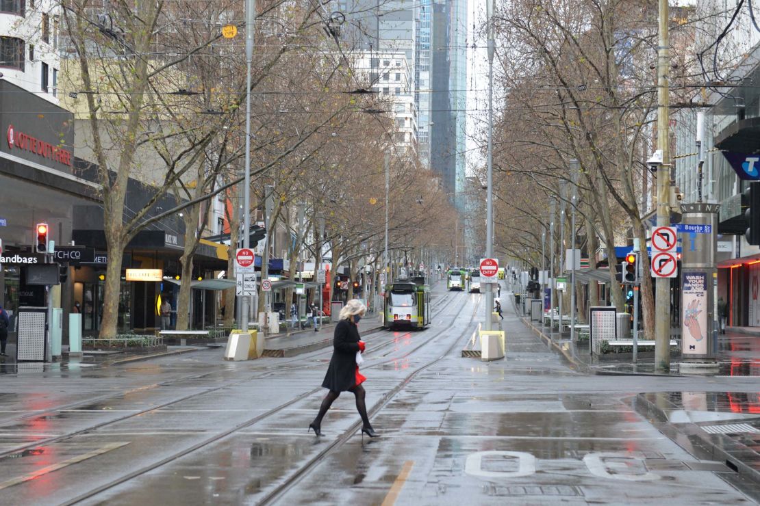 A woman in Melbourne's nearly empty city center during this month's lockdown. 