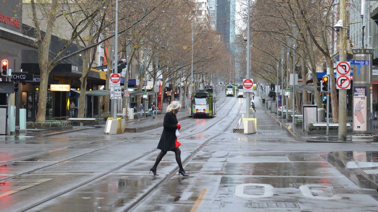 A woman in Melbourne's nearly empty city center during this month's lockdown.