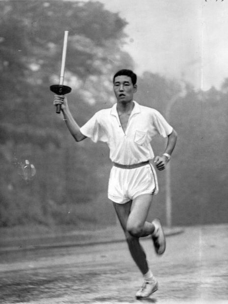 Final torch bearer Yoshinori Sakai runs during a rehearsal in Tokyo, Japan, in 1964.