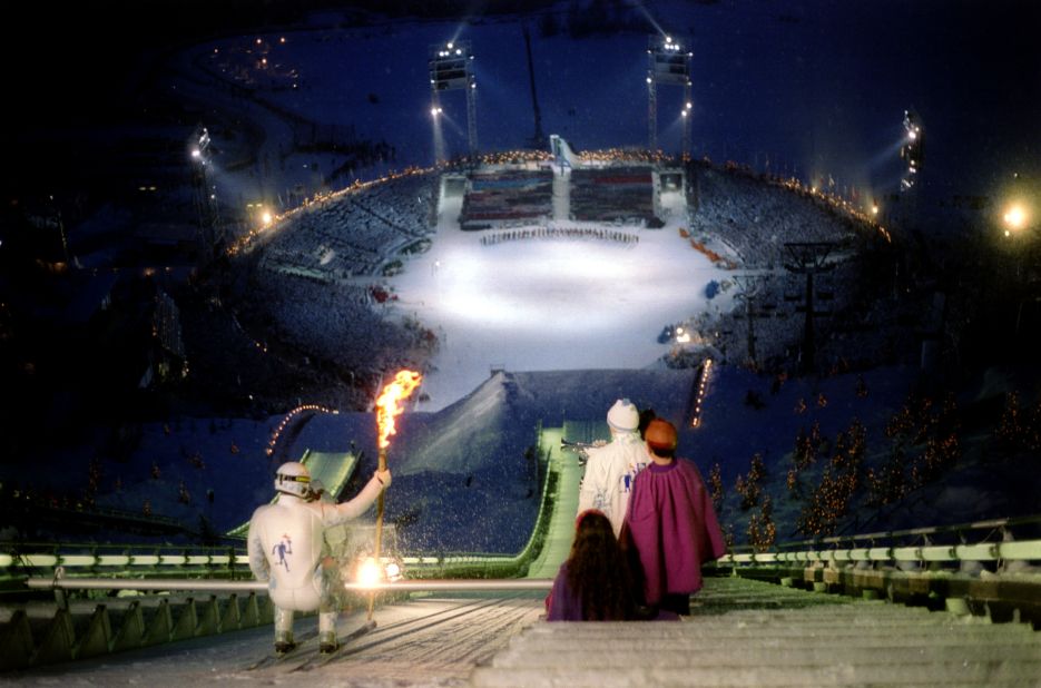 Ski jumper Stein Gruben prepares for his descent with the Olympic torch during the opening ceremony at the 1994 Lillehammer Winter Olympics.