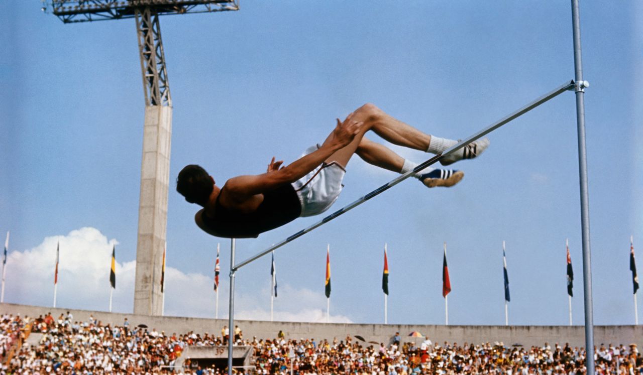 American high jumper Dick Fosbury clears the bar on the way to winning Olympic gold in 1968. His back-first jumping style revolutionized the sport, and the "Fosbury Flop" is now used by almost everyone who competes in the event.