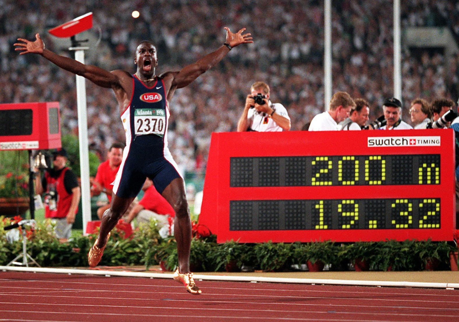 Michael Johnson and his flashy gold shoes set a new world record in the 200 meters, finishing in 19.32 seconds in 1996. The American also added gold in the 400 meters that year.