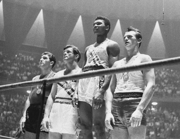 Muhammad Ali rose to prominence at the 1960 Olympic Games in Rome, where he claimed a gold medal in the light-heavyweight division. The story goes that when he returned to a hometown parade, even with the medal around his neck, he was refused service in a segregated restaurant because of his race. According to several reports, he threw the medal into a river out of anger. The story is disputed by people who say Ali misplaced the medal. Thirty-six years later, he was given a replacement medal and asked to light the cauldron at the 1996 Olympic Games in Atlanta, something he said was one of the greatest honors in his athletic career.