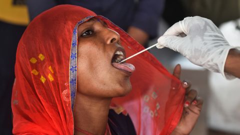 A health worker collects a swab sample for a Covid-19 test in Mumbai, India, on July 16.