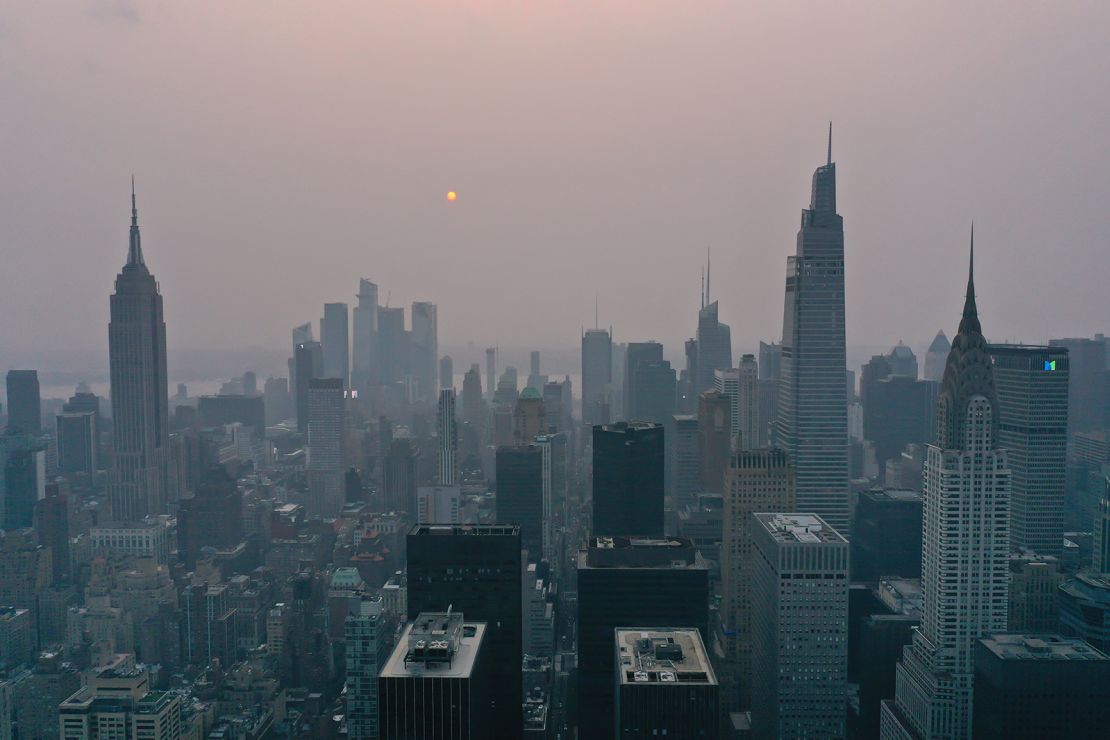 Wildfires burning out of control across the western US send haze across the continent to New York City, on July 20.