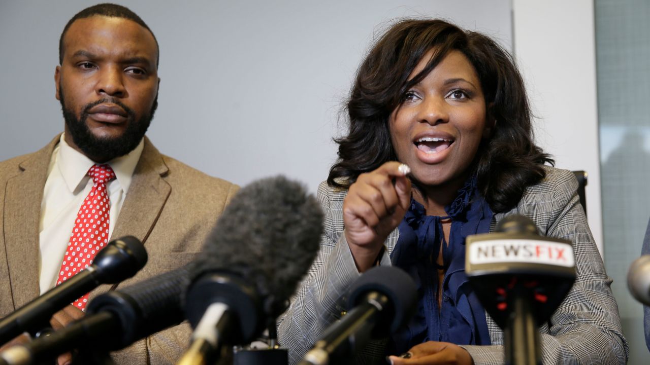 Jasmine Crockett, right, speaks alongside civil rights attorney Lee Merritt listens during a news conference in Dallas in 2017.