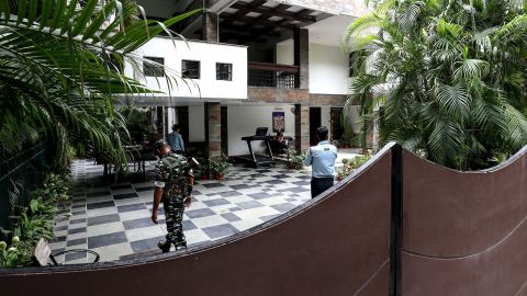 Security personnel at the Bhopal home of Sudhir Agrawal, managing director of Dainik Bhaskar. His residence was raided by Indian officials as part of a tax investigation. 