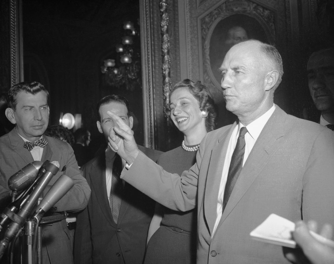 Sen. Strom Thurmond is surrounded by reporters as he steps from the Senate Chamber after ending his 24-hour filibuster  against the Civil Rights Bill of 1957. 