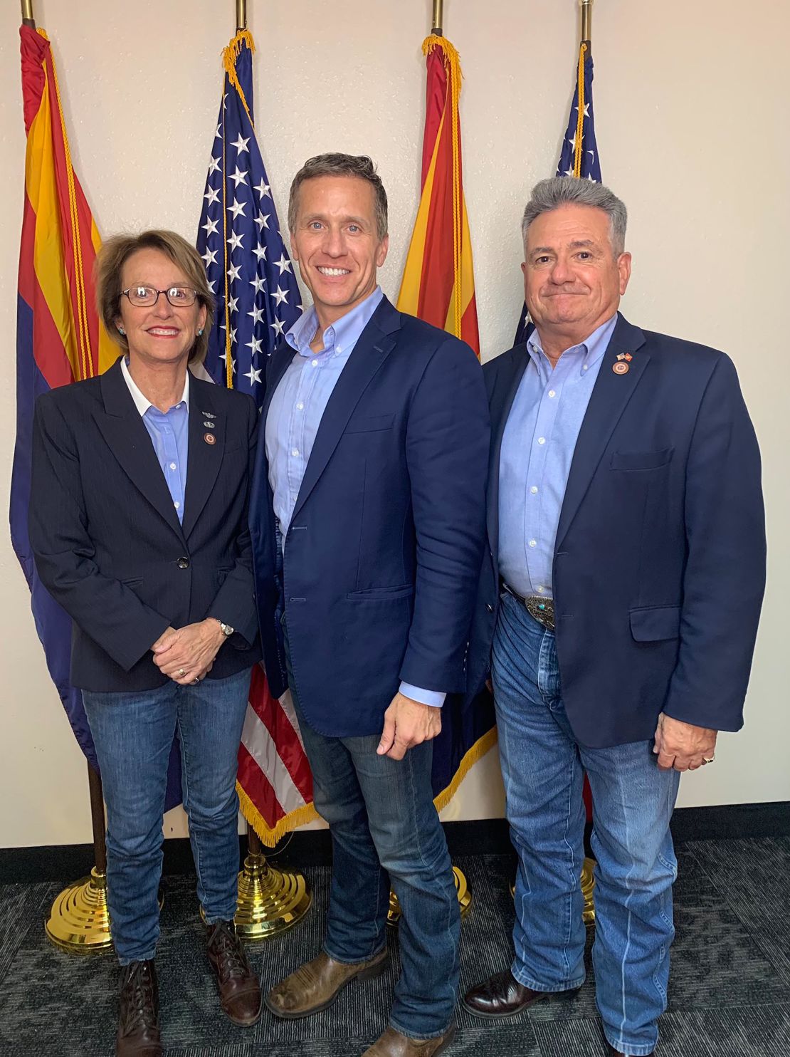 Former Missouri Gov. Eric Greitens, (center) now running for a US Senate seat, poses with Arizona state senators Wendy Rogers and Sonny Borrelli before his June 12 tour of the Arizona Senate's audit site. 