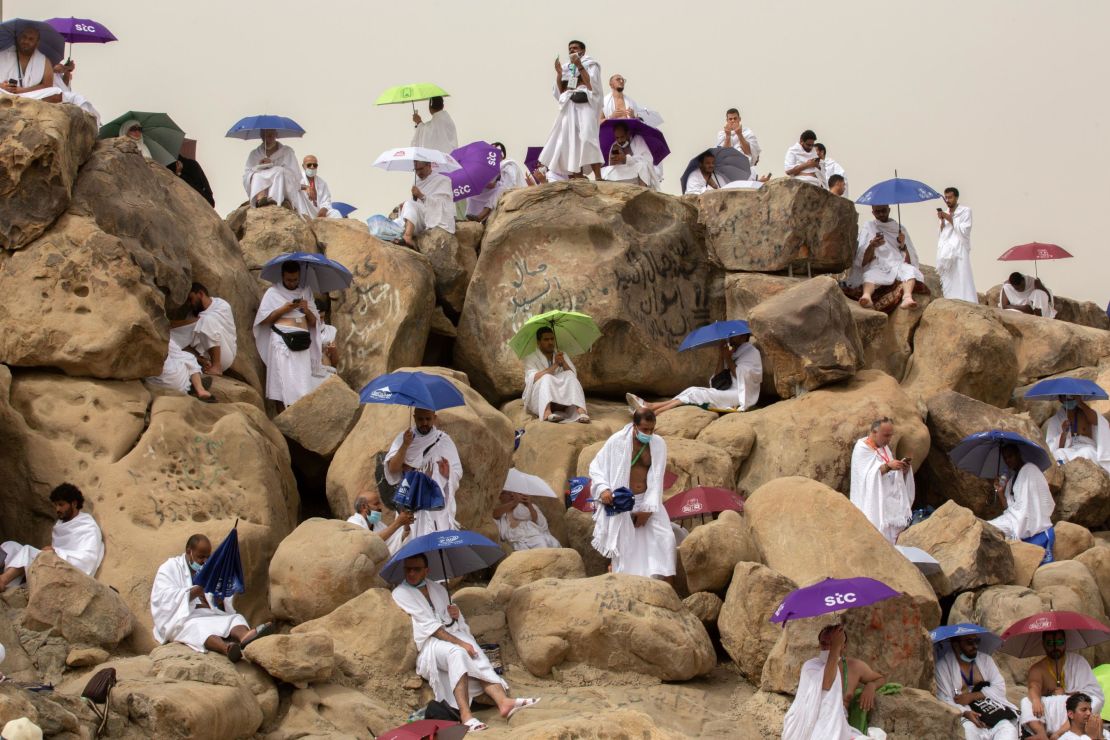 Muslim pilgrims gather to pray on Saudi Arabia's Mountain of Mercy in July 2021. 