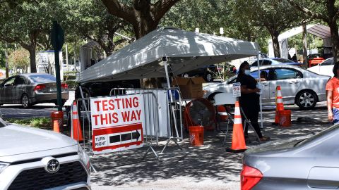 People wait at a testing and vaccination site in Barnett Park, Florida. One in five of all cases in the US are occurring in the state, White House officials say.
