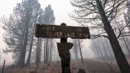A sign damaged by the Bootleg Fire stands among the haze on Thursday, July 22, 2021, near Paisley, Oregon.