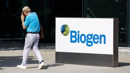 A pedestrian walks past Biogen Inc. headquarters in Cambridge, Massachusetts, U.S., on Monday, June 7, 2021. Biogen Inc. shares soared after its controversial Alzheimer's disease therapy was approved by U.S. regulators, a landmark decision that stands to dramatically change treatment for the debilitating brain condition. Photographer: Adam Glanzman/Bloomberg via Getty Images