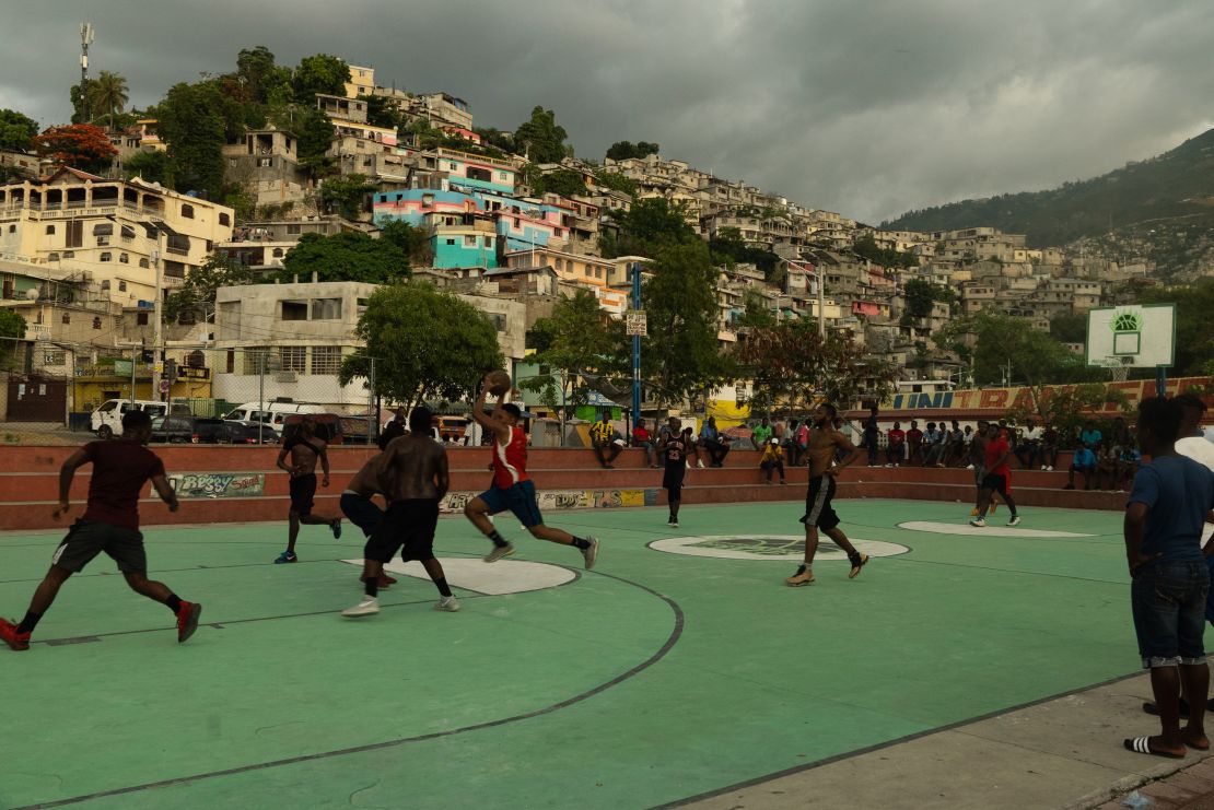 Men playing basketball in Port-au-Prince. Thousands have fled their homes in the capital since June. 