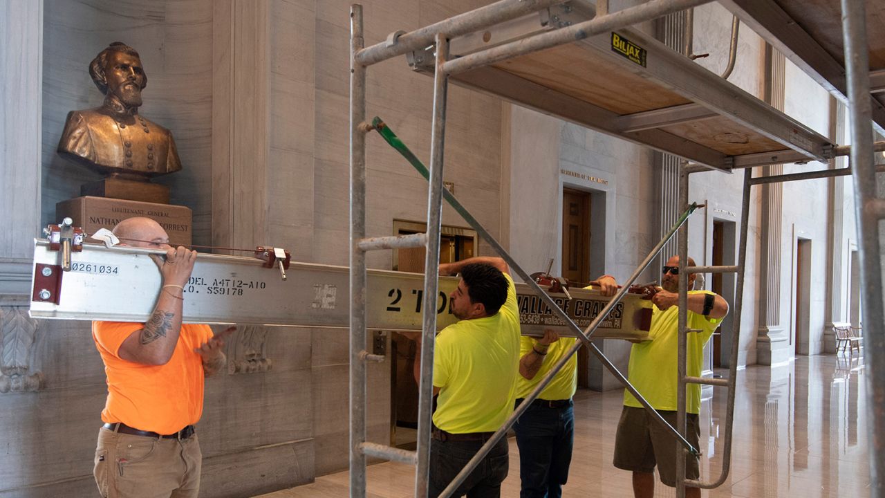 Workers prepare scaffolding at the Nathan Bedford Forrest bust in the State Capitol in Nashville, Tennessee, on July 22, 2021.