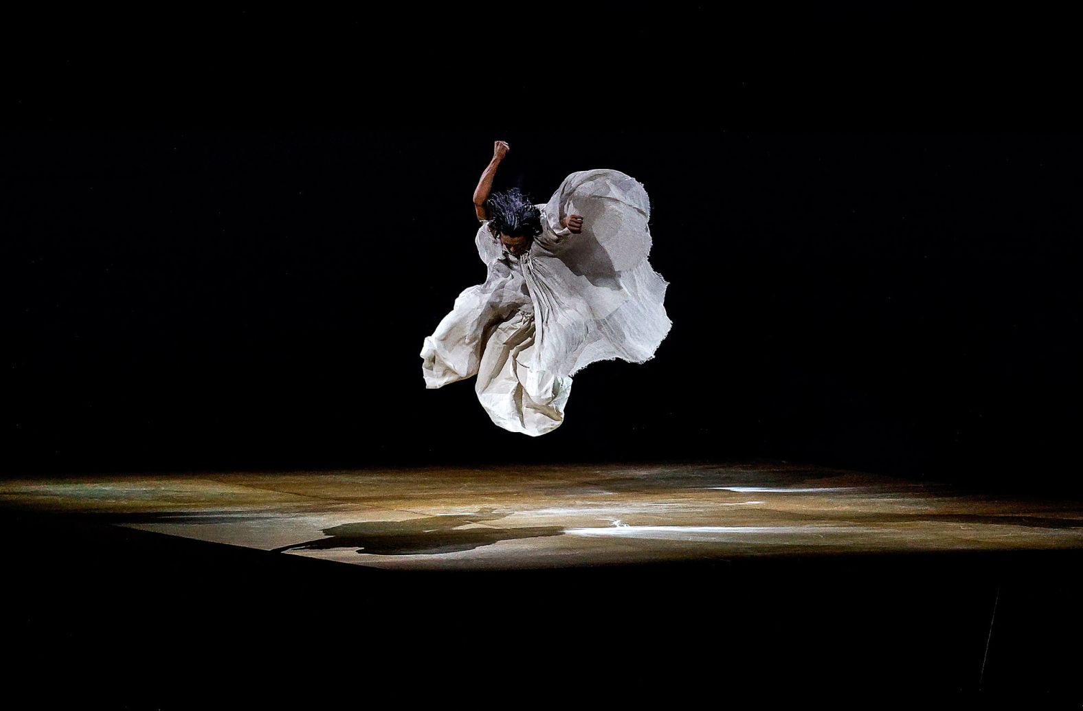 A performer acts during the opening ceremony.