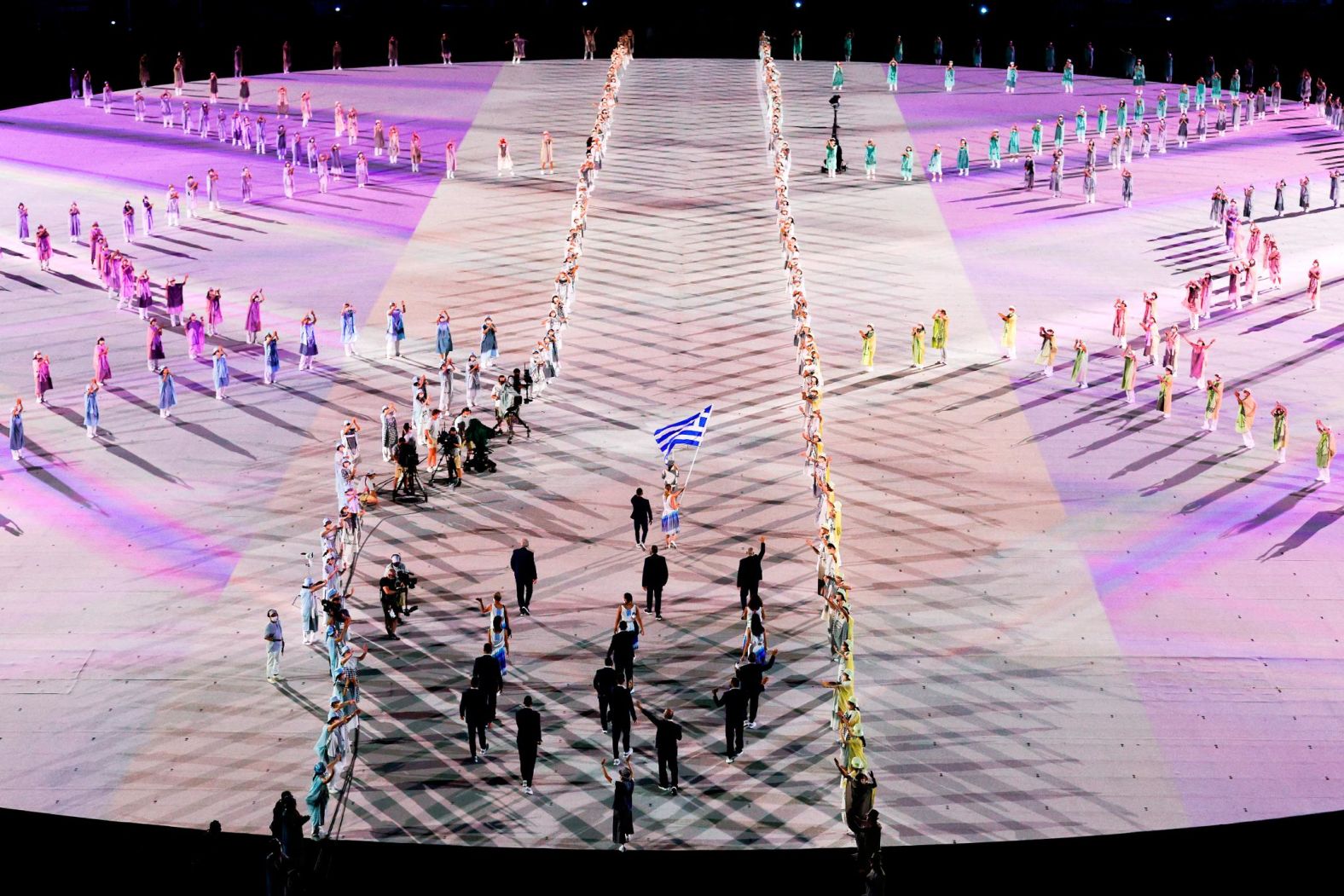 Greece's athletes march into the stadium to kick off the parade of nations.