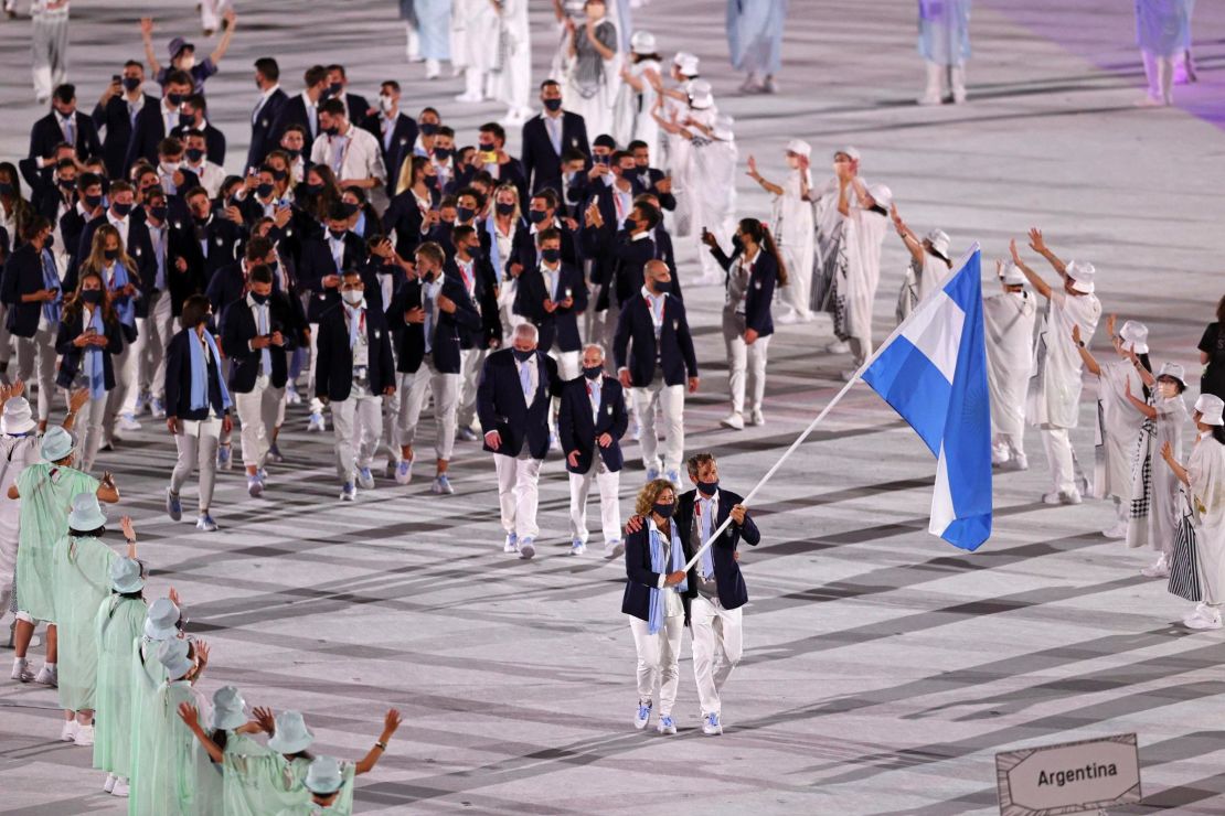 Flag bearers Cecilia Carranza Saroli and Santiago Raul Lange of Team Argentina lead their team in the stadium during the Opening Ceremony of the Tokyo 2020 Olympic Games.
