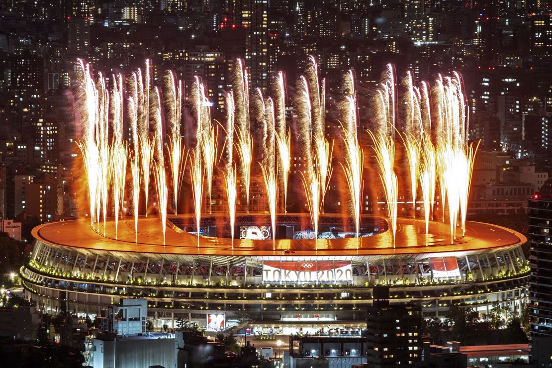 Fireworks light up the sky over the Olympic Stadium during the Tokyo Olympics Opening Ceremony. 