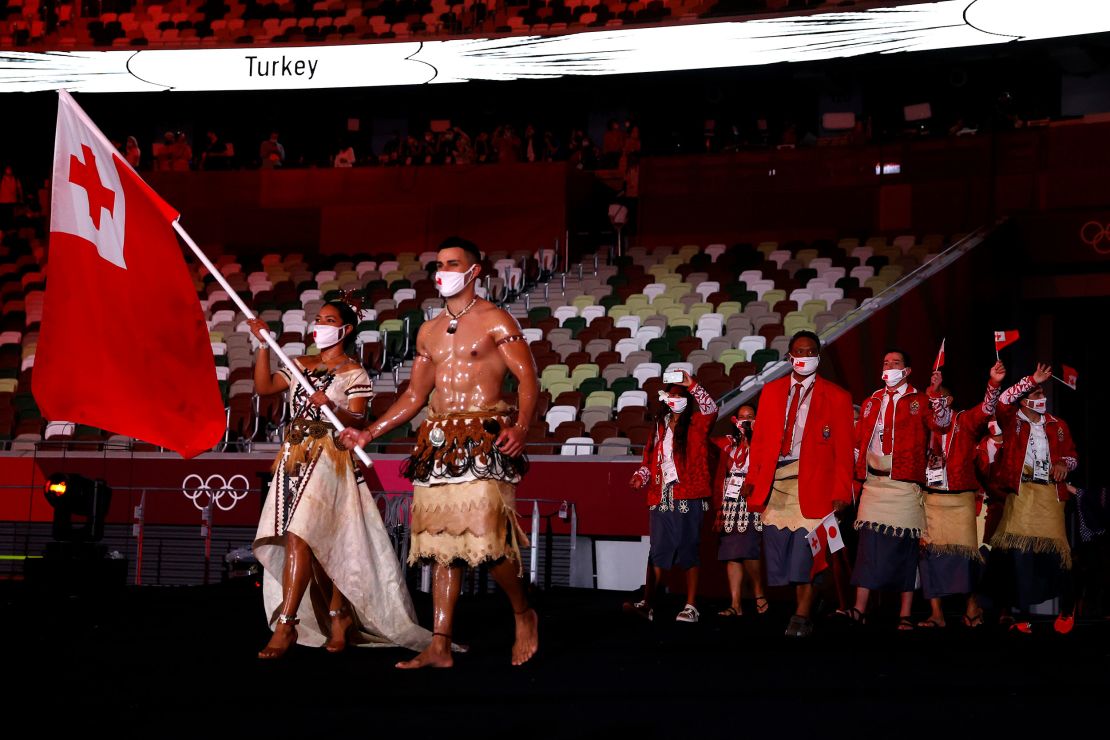 Pita Taufatofua leads out Team Tonga during the opening ceremony.